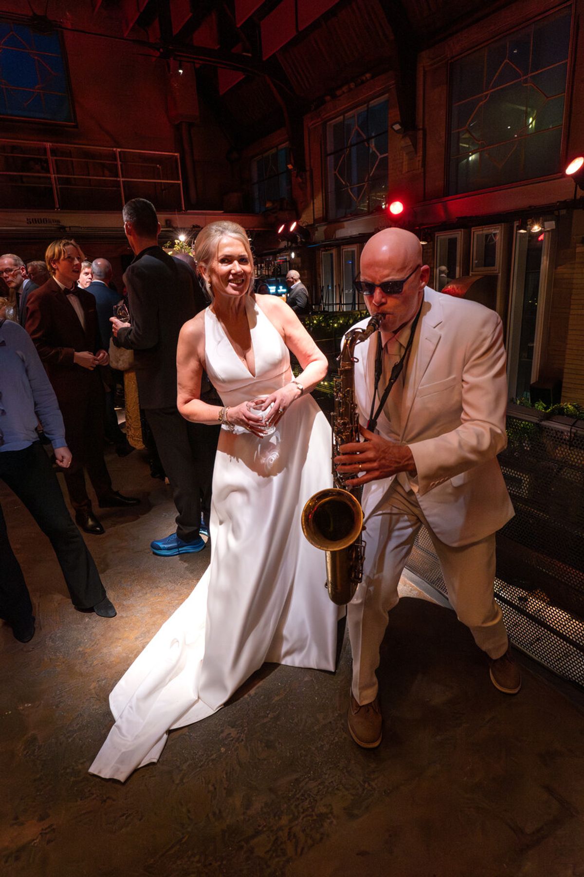 Tal performing saxophone at a wedding